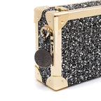 BOLSA CLUTCH TRUNK PEQUENA  METALIZADO TWEED GLAM ROXY